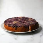 Blueberry upside down cake on a grey platter
