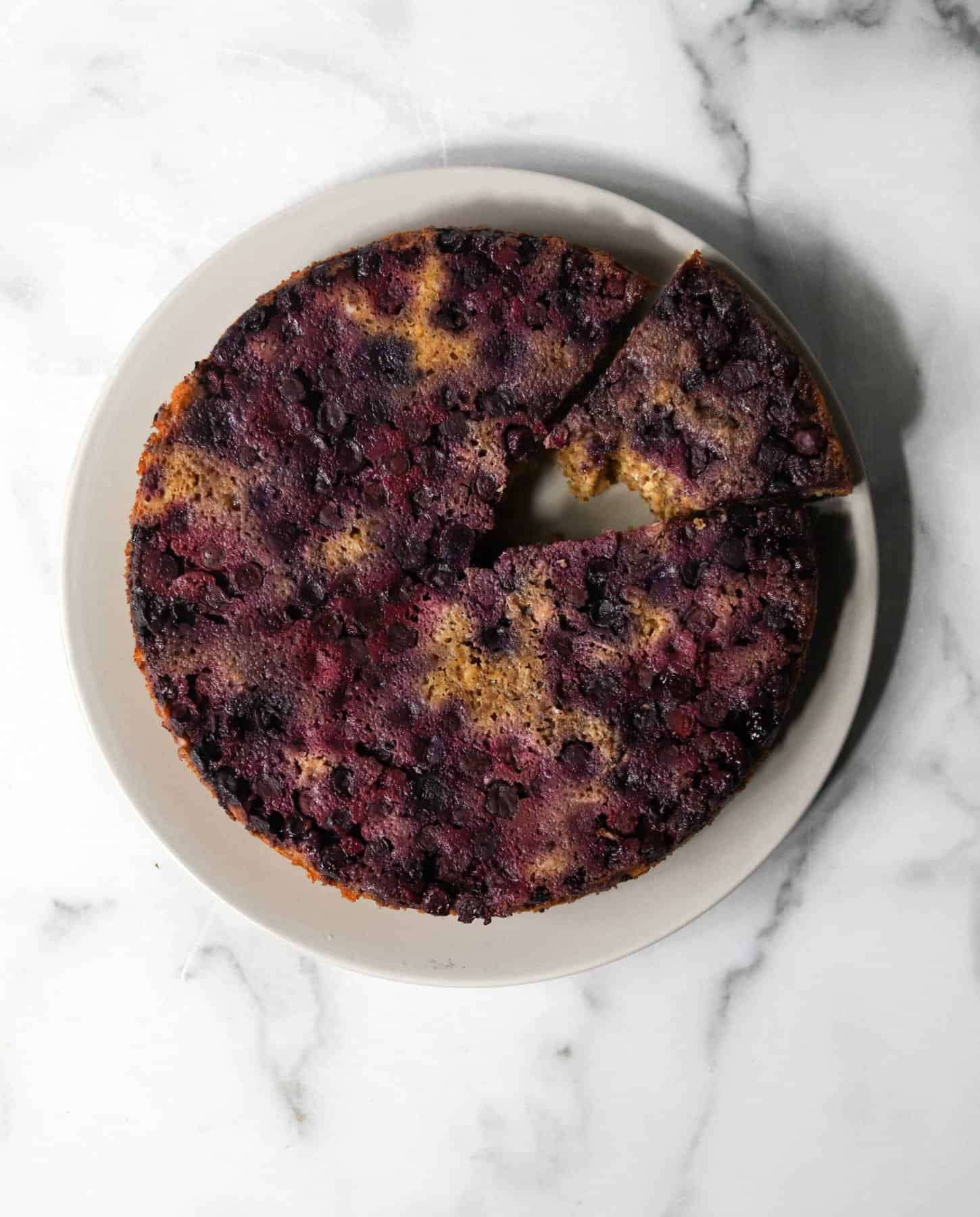 Blueberry upside down cake on a grey plate