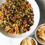 Cowboy caviar in a white bowl with tortilla chips