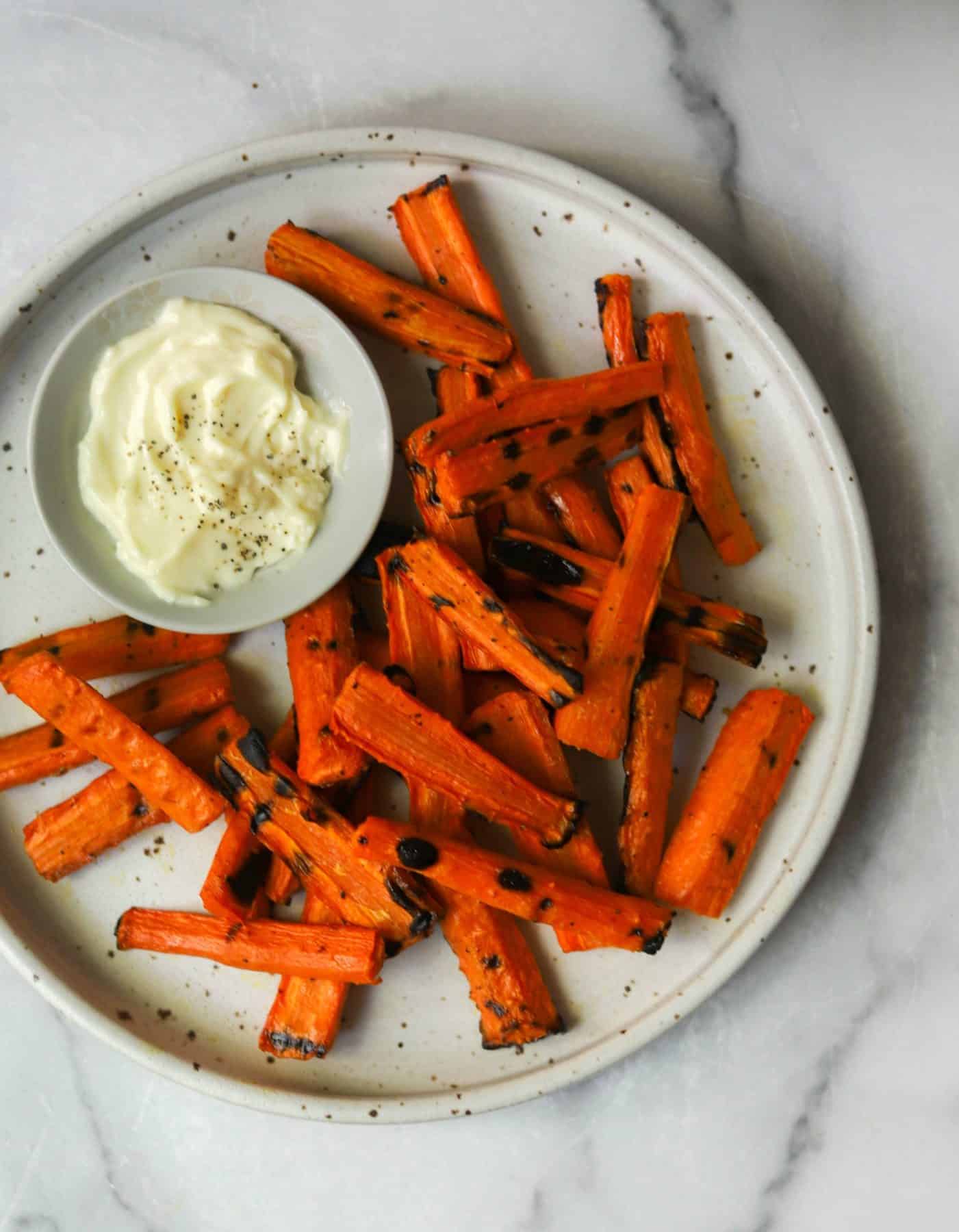 Grilled carrot fries on a plate