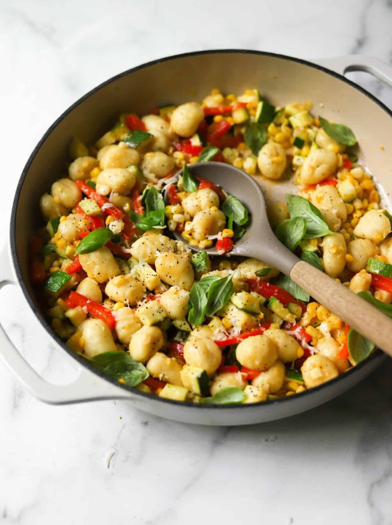 Healthy summer recipe for gnocchi skillet in a white dish