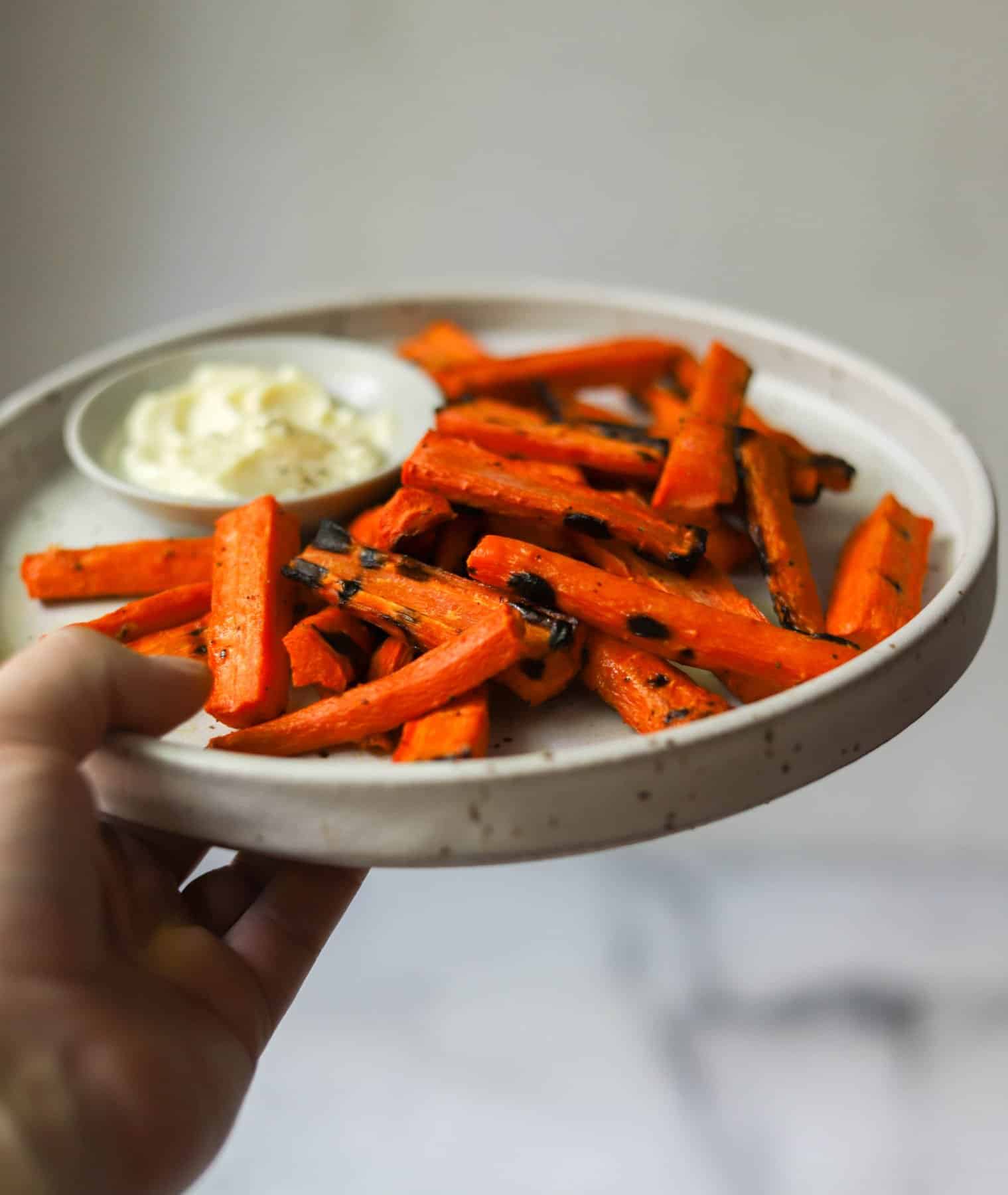 Grilled carrot fries on a stone plate