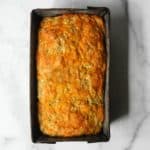 Cheesy zucchini bread in a tin