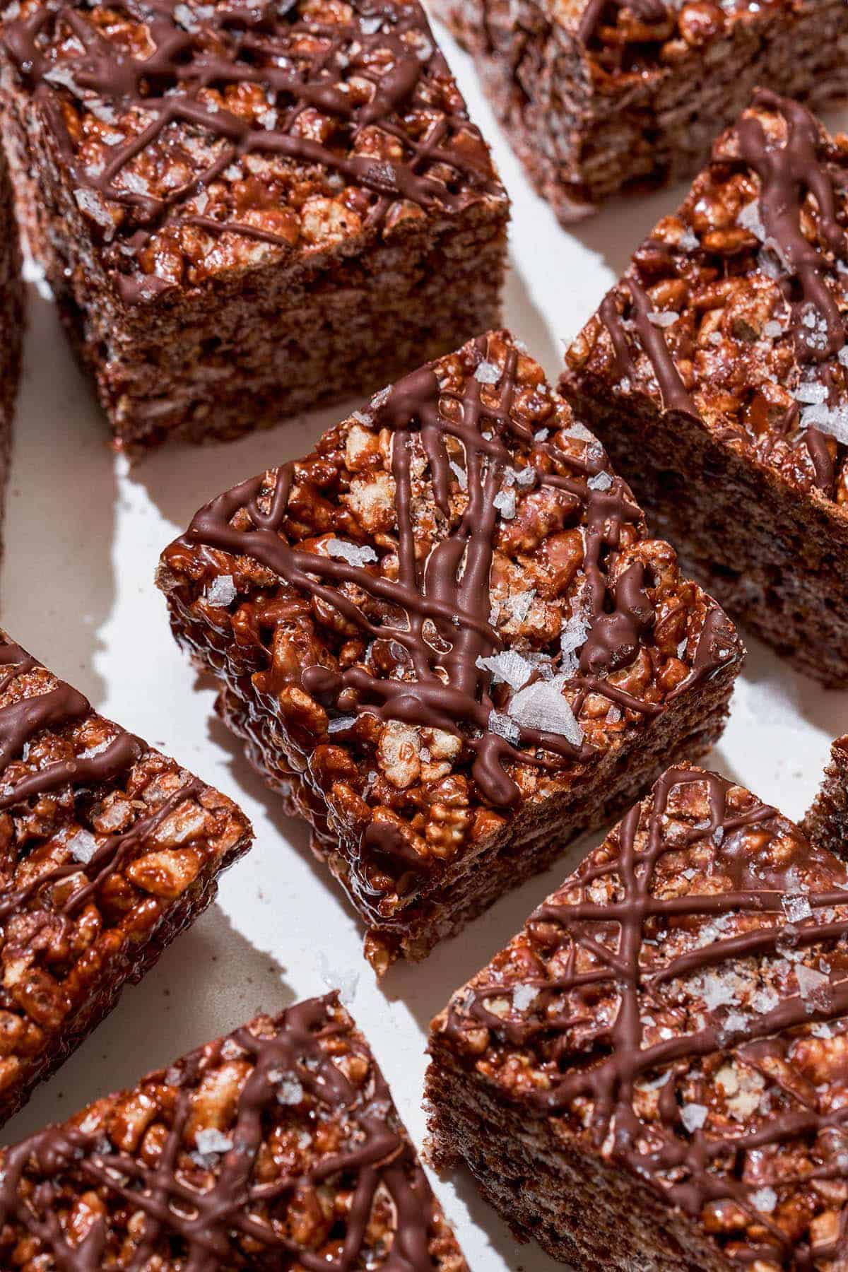 A front shot of squares of chocolate rice krispie treats.
