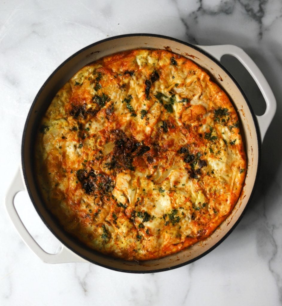 Chorizo cauliflower frittata in white casserole dish