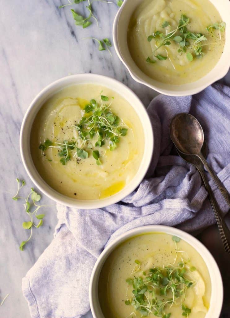 Potato leek soup in white bowls