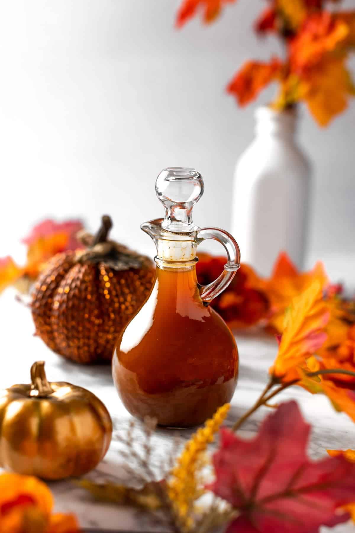 A front shot of a bottle of pumpkin pie spice syrup.