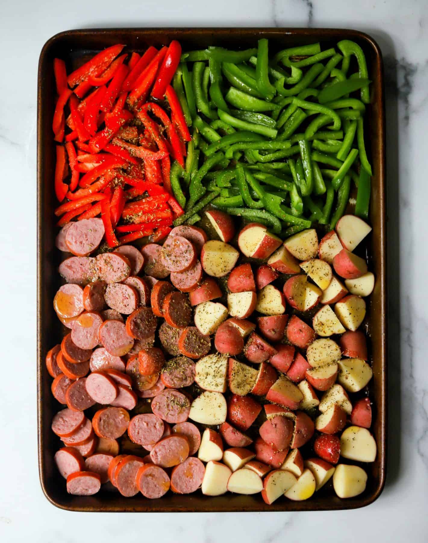 Sausage, potatoes and bell peppers on a sheet pan