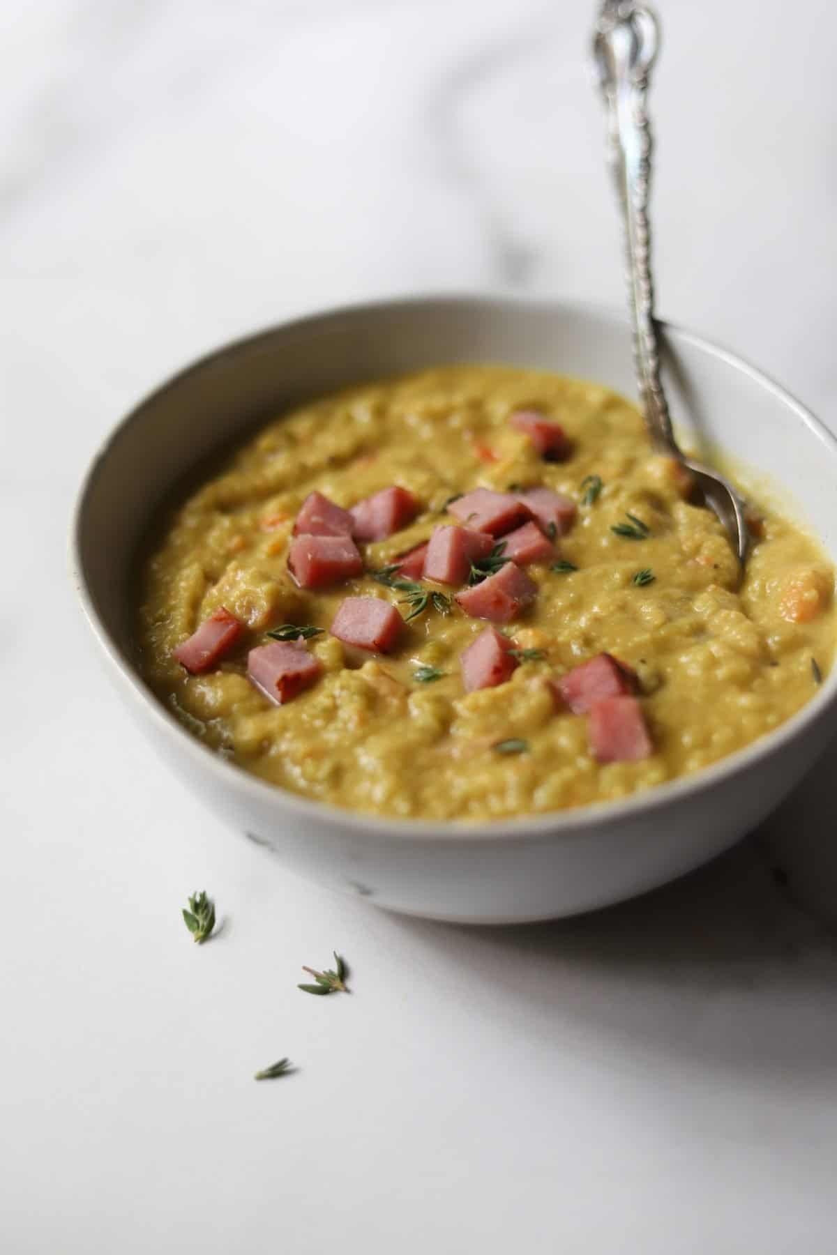 Instant Pot Split Pea & Ham Soup in a white bowl