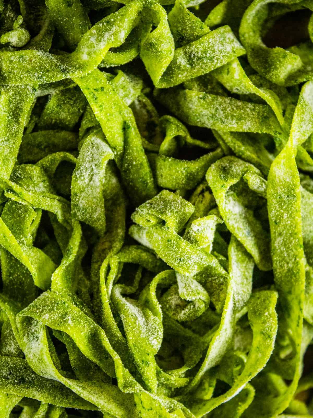 An overhead close up shot of homemade spinach fettucine.
