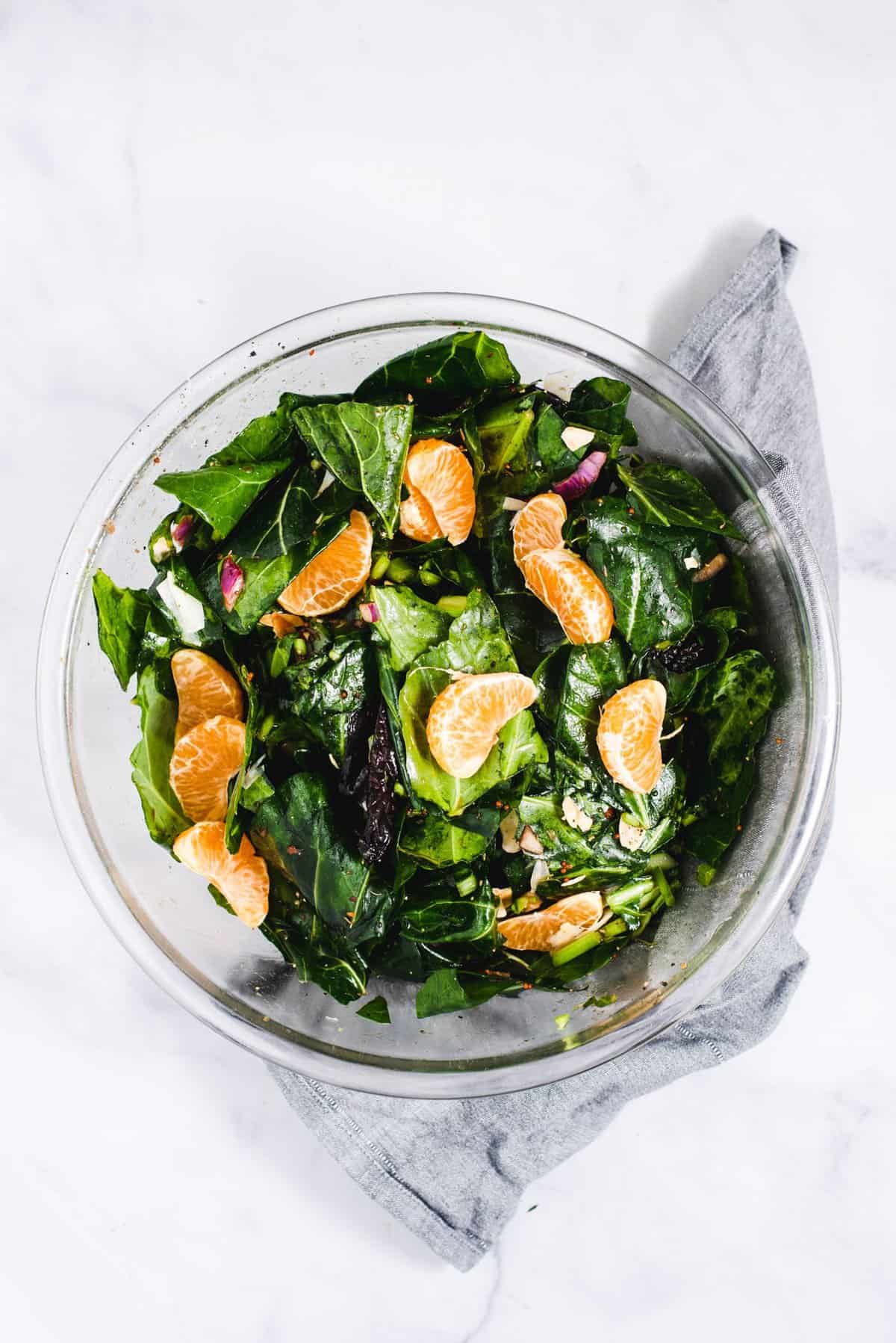 An overhead shot of a bowl of marinated kale salad.