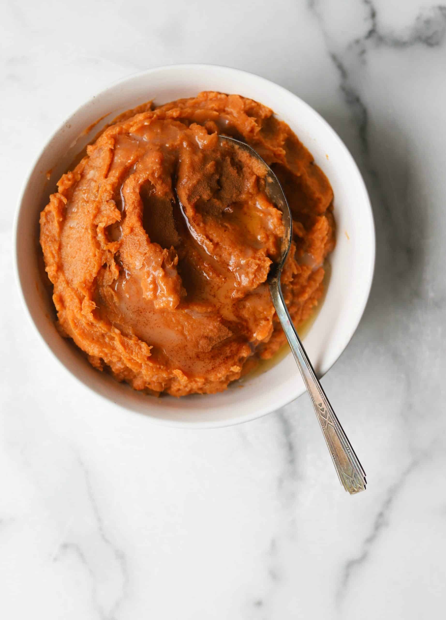 Maple mashed sweet potatoes in a white bowl