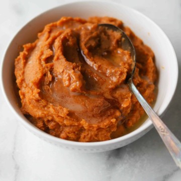 Maple mashed sweet potatoes in a white bowl