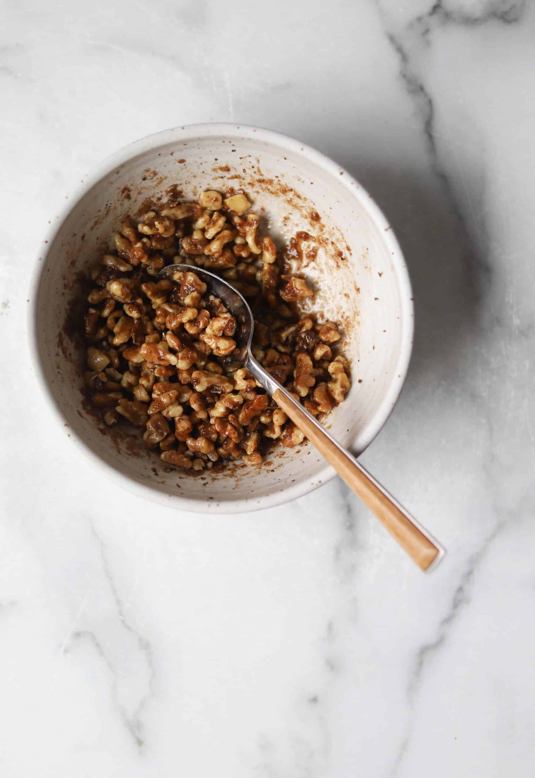 Walnut crumble in a speckled bowl