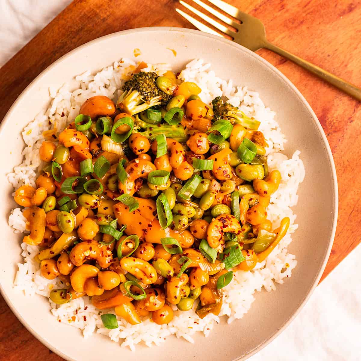 An overhead shot of a bowl of sticky cashew chickpeas.