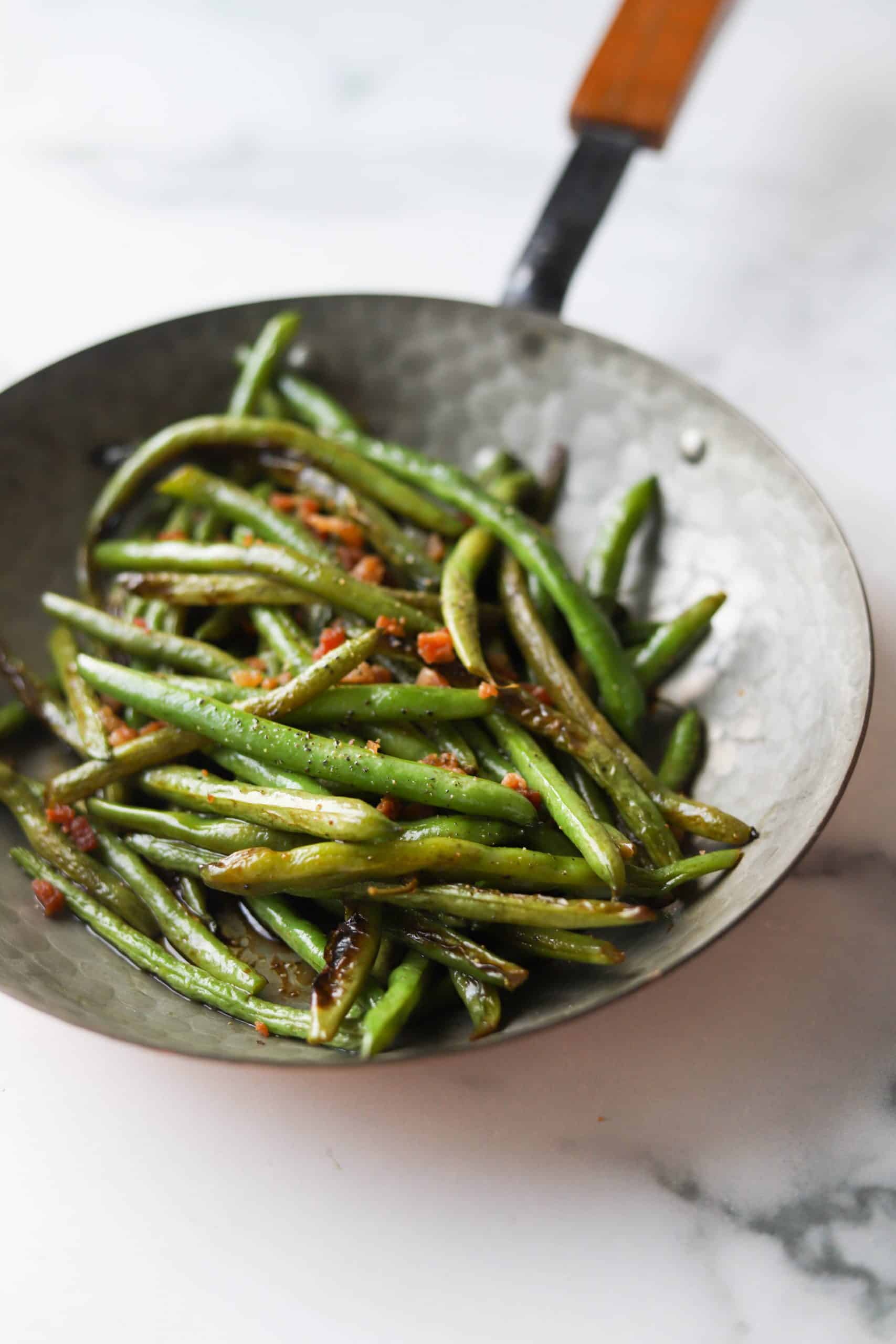 Bacon green beans in a copper pan