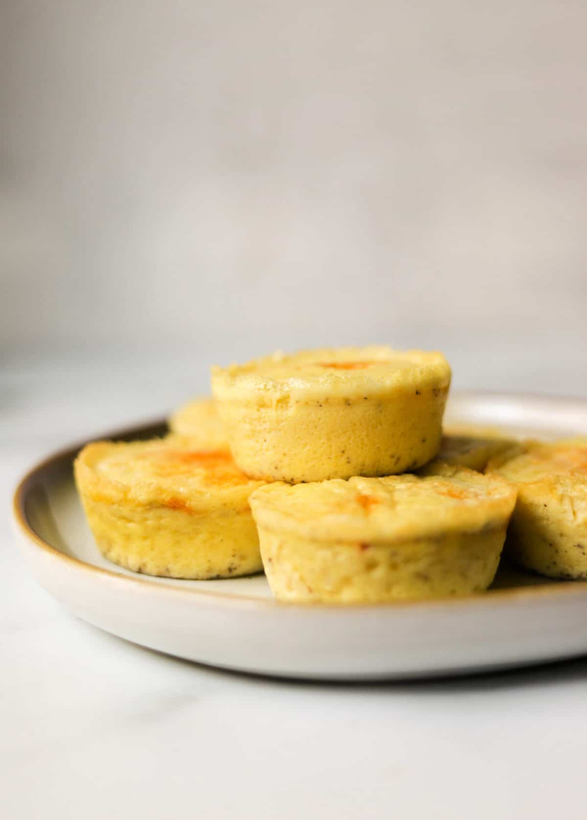 A side shot of egg bites on a plate.