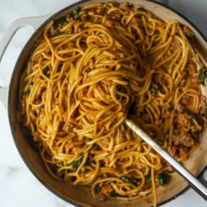 Spicy dan dan noodles in a white pan