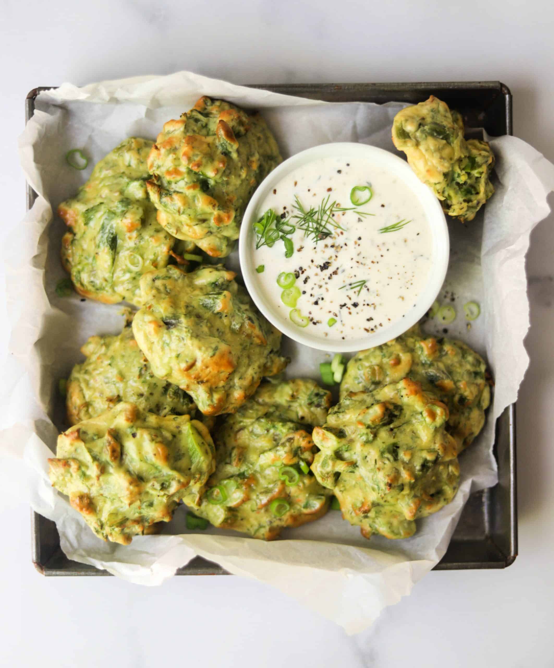 A tray filled with asparagus fritters.