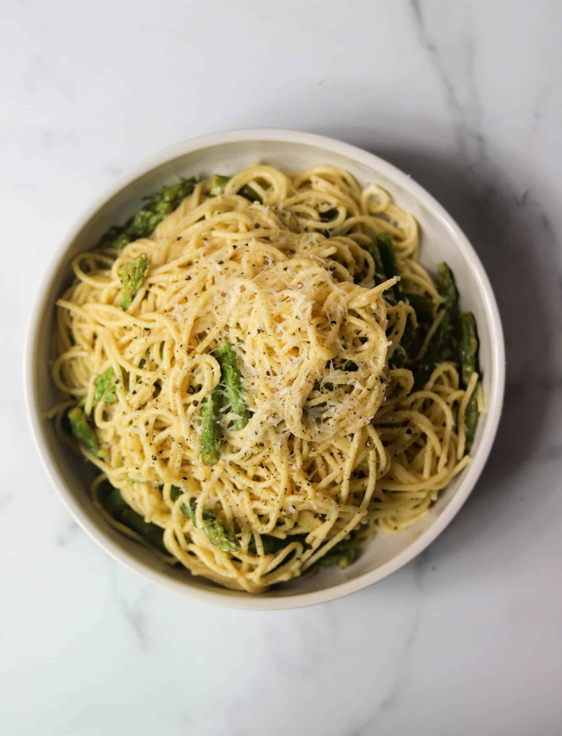 An overhead shot of a bowl of lemon asparagus spaghetti.