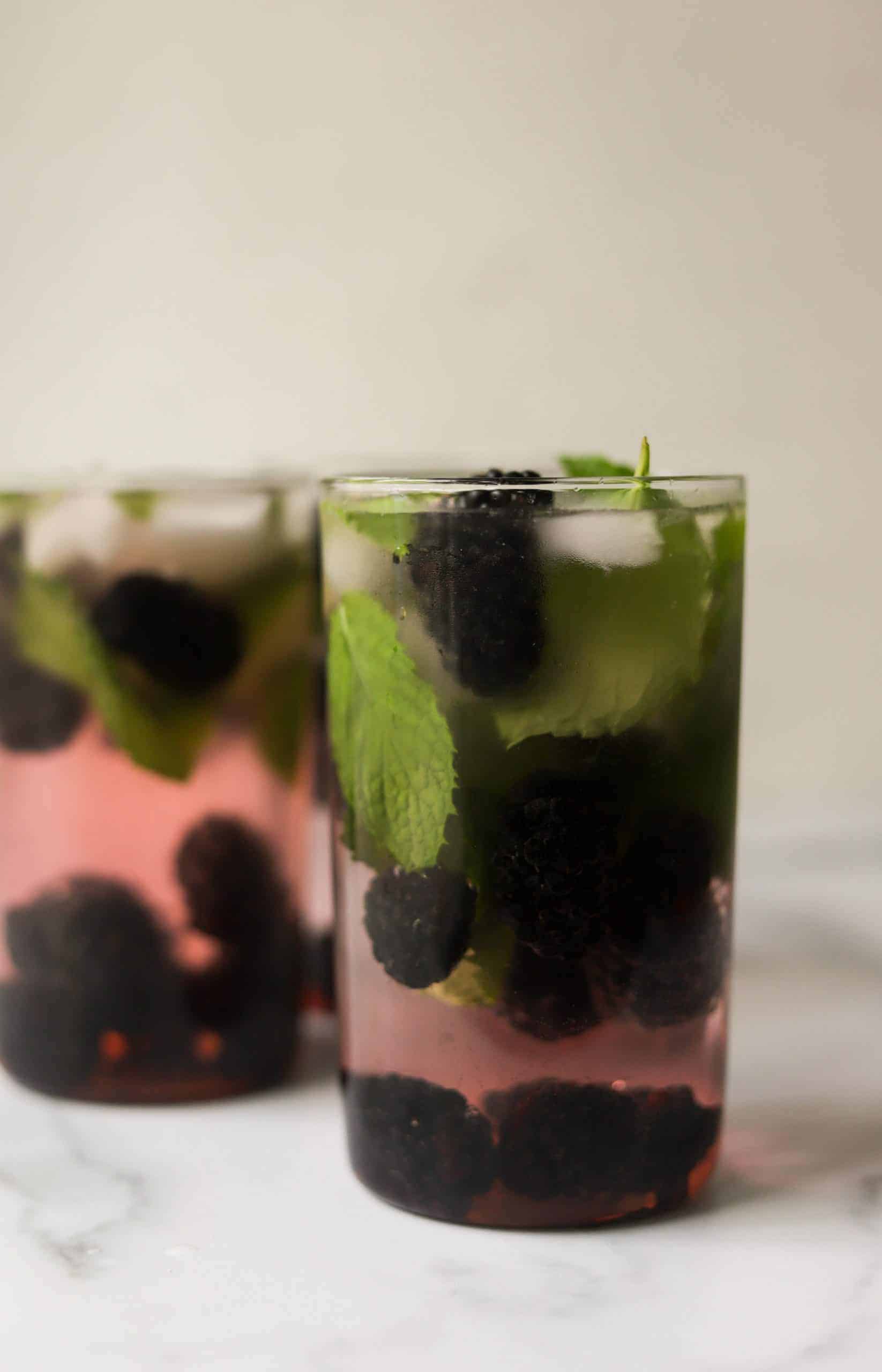 A side shot of blackberry mojitos.