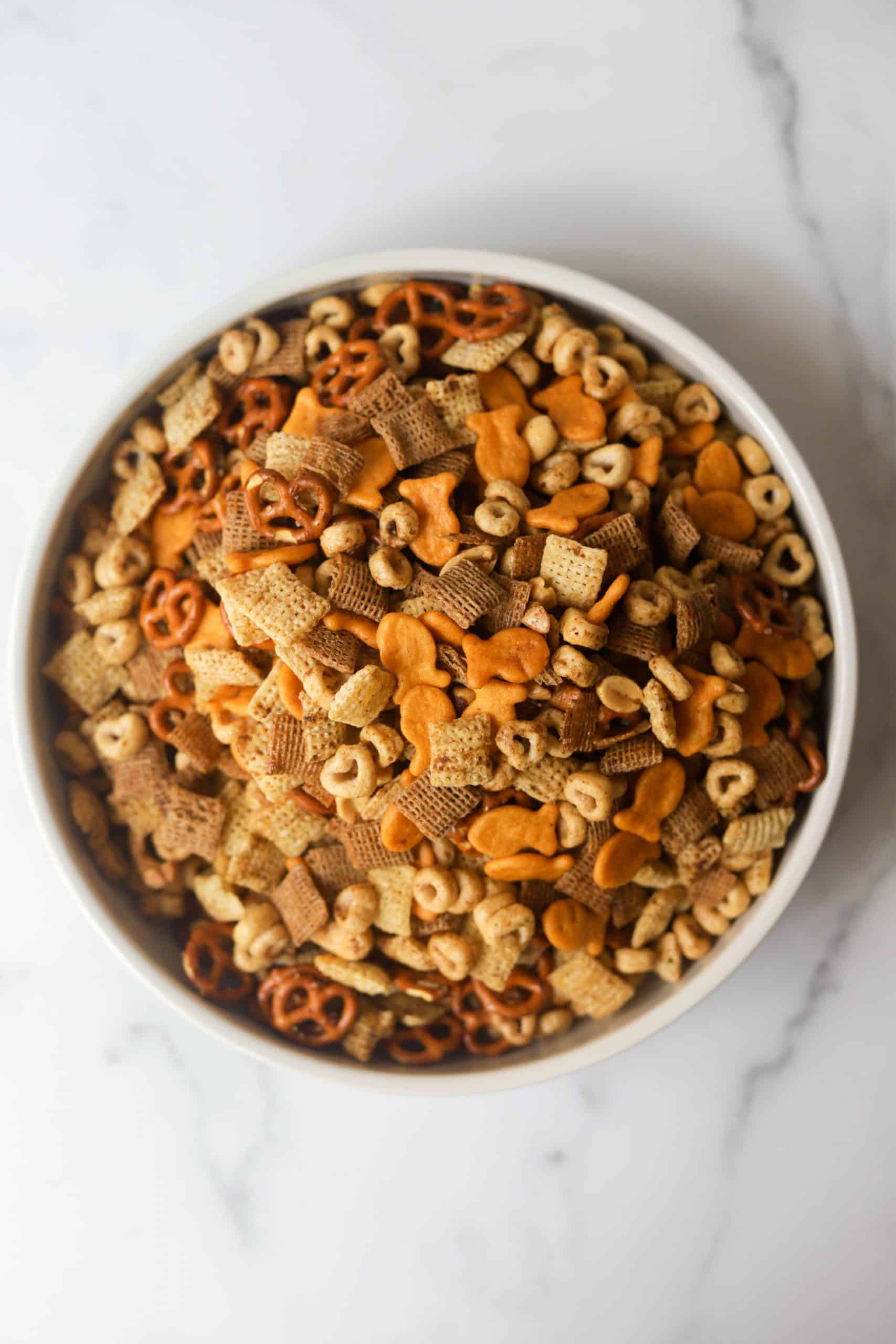 A white bowl filled with healthy chex mix.