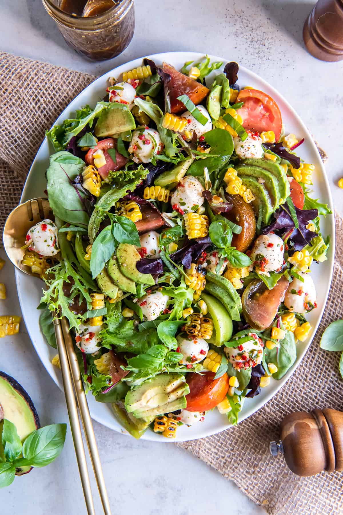 An overhead shot of a plate of avocado and grilled corn salad.