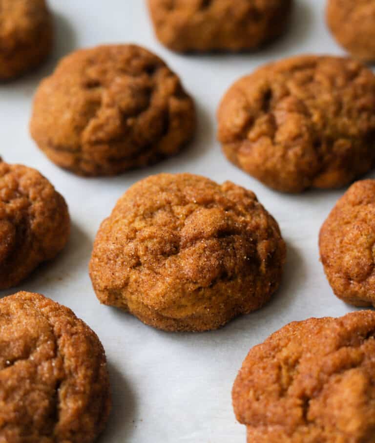 pumpkin snickerdoodle cookies on a marble countertop