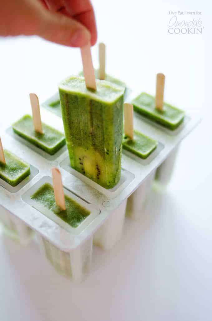 A side shot of a green kiwi popsicle.