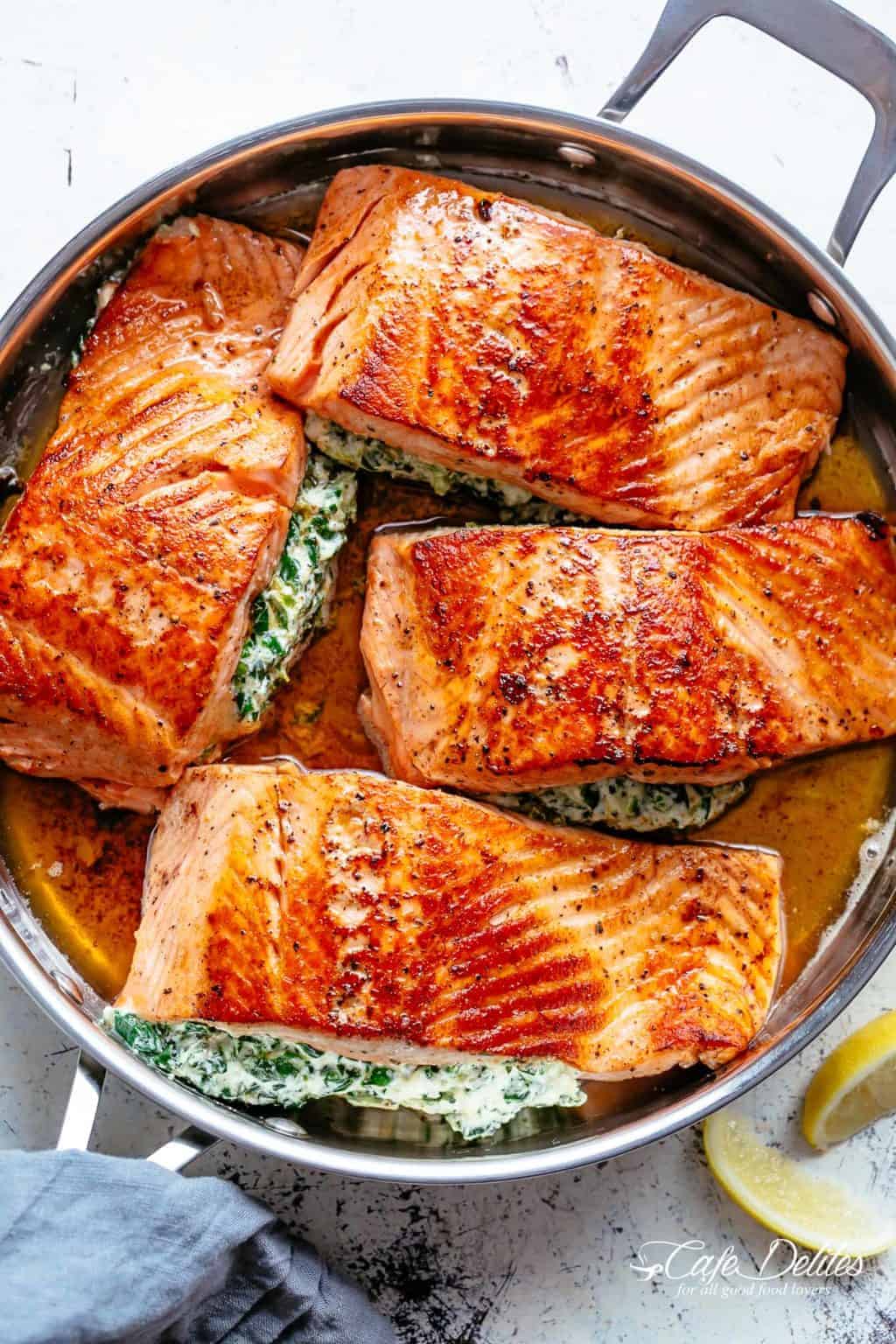 An overhead shot of sauteed salmon in a skillet.