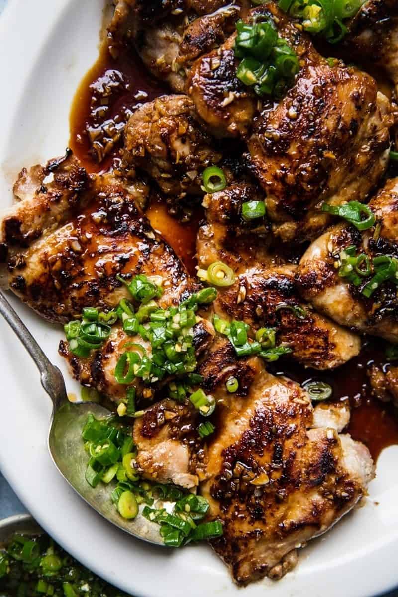 An overhead shot of a platter of lemongrass chicken thighs.