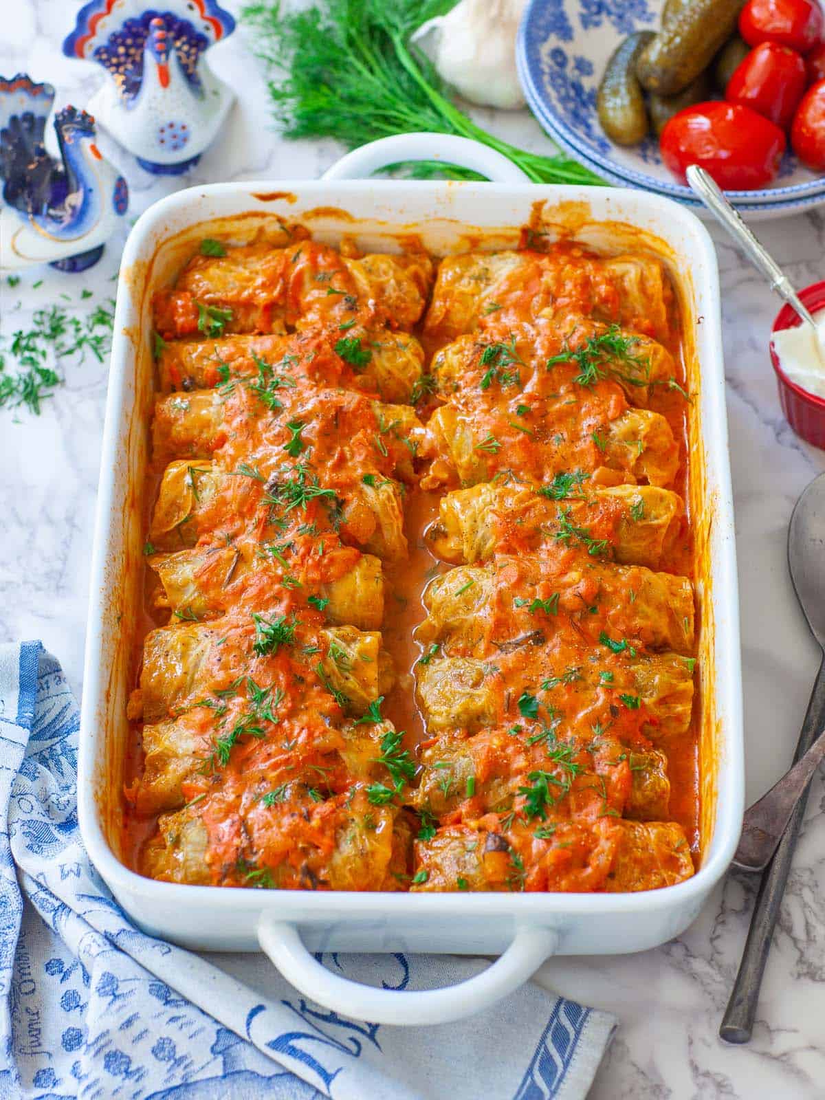 An overhead angled shot of a pan of stuffed cabbage rolls.