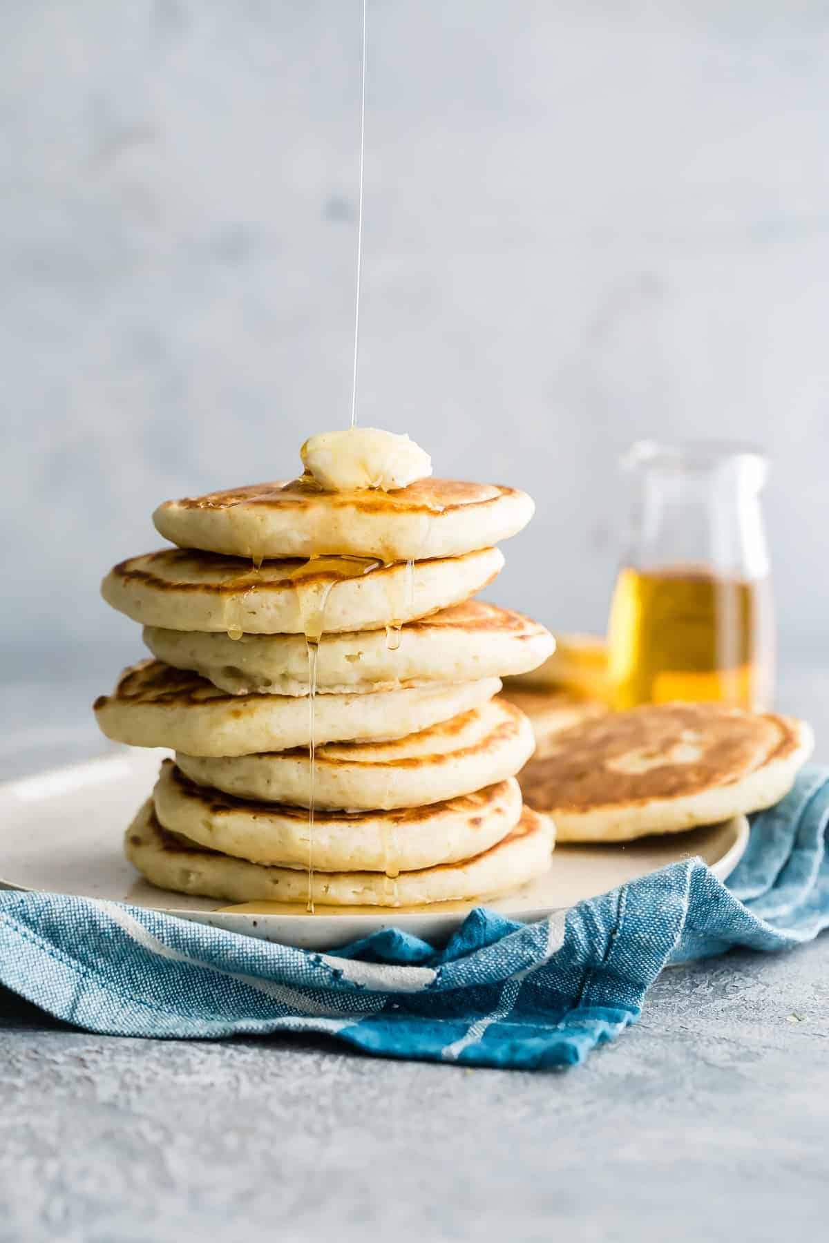 A side shot of a stack of pancakes.