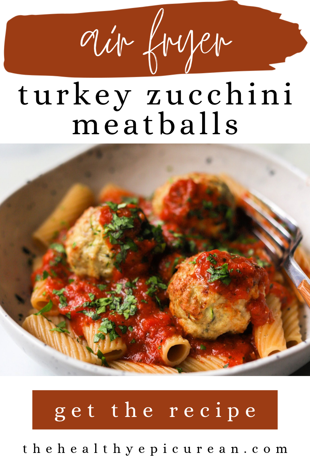 Air fryer zucchini meatballs over high-fiber rigatoni in a bowl.